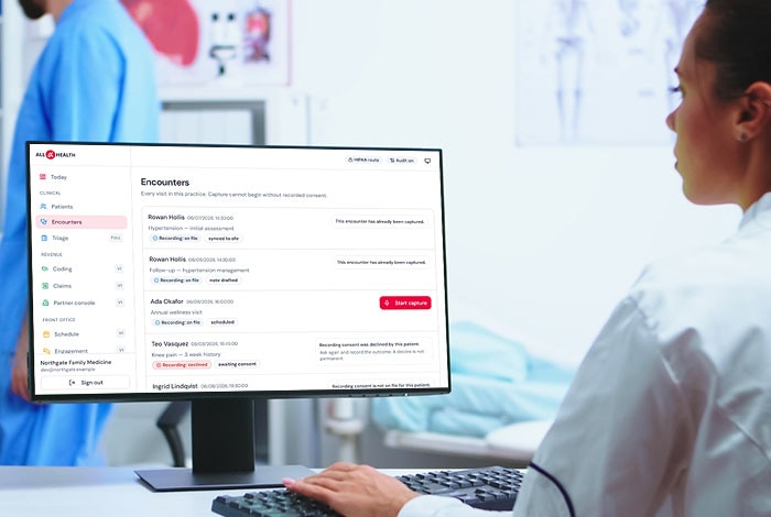 A clinician working through the encounters list on a practice workstation