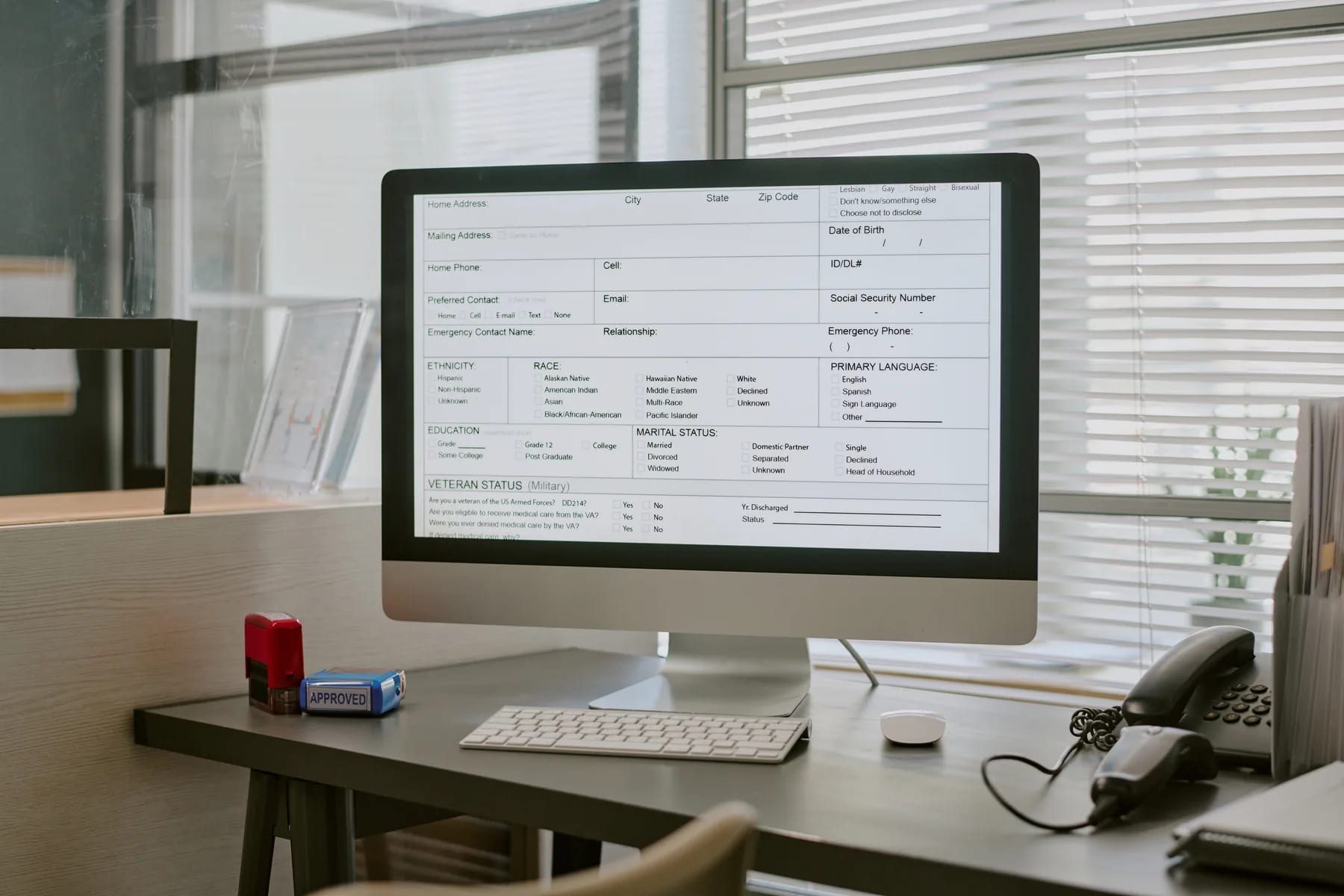 A long questionnaire filled out on screen, approval stamp beside it