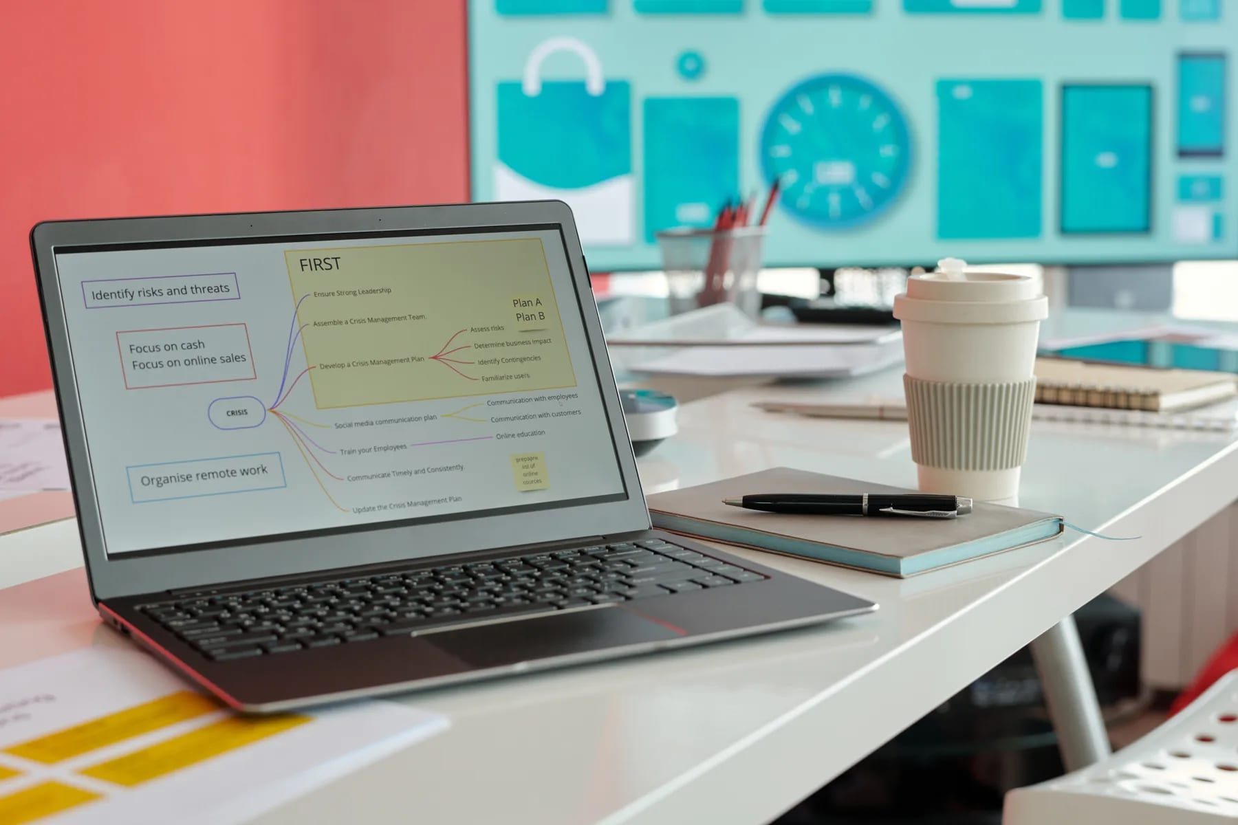 A forecast laid out on a laptop in a bright planning room