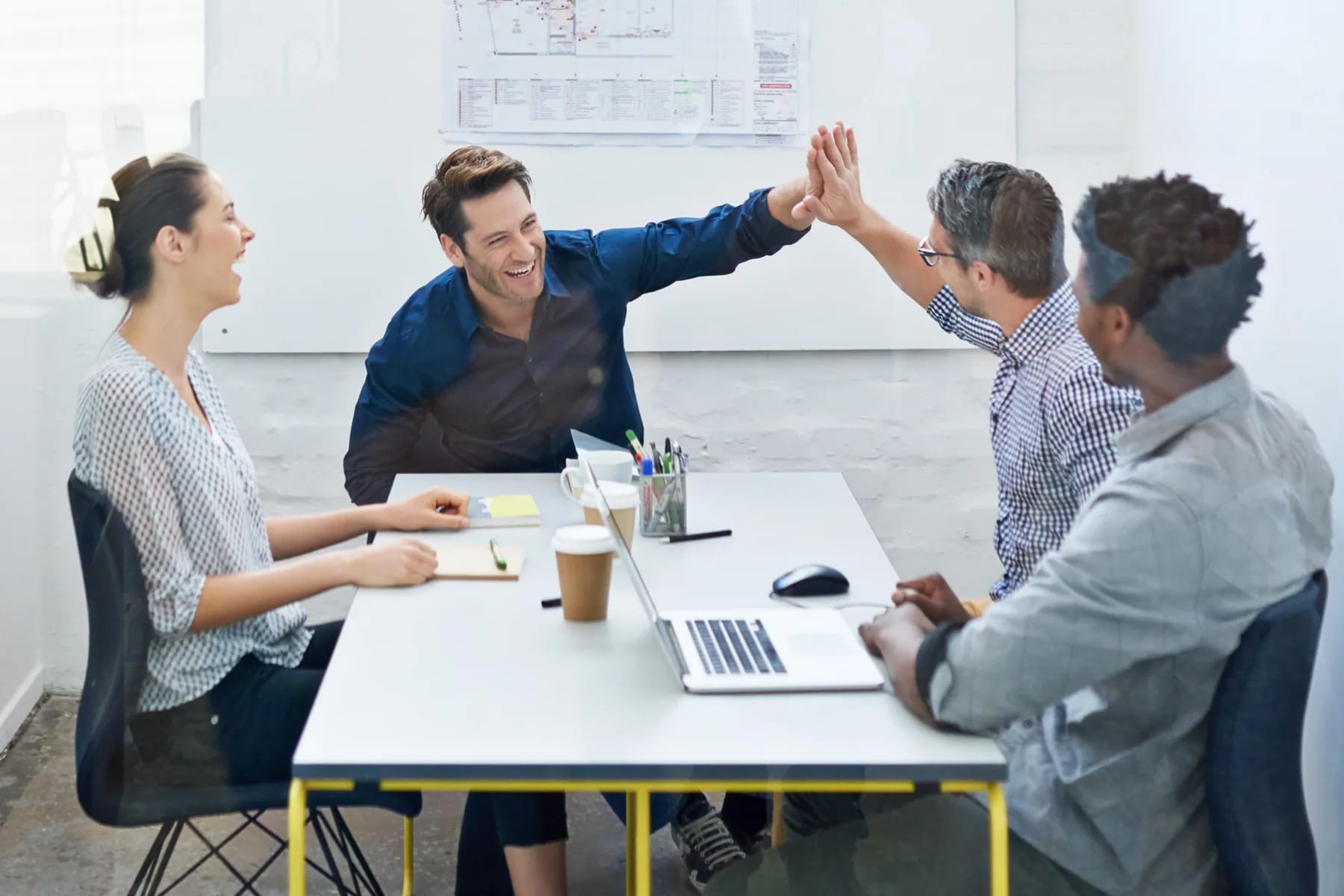A hiring panel and a new joiner sealing the decision across the table