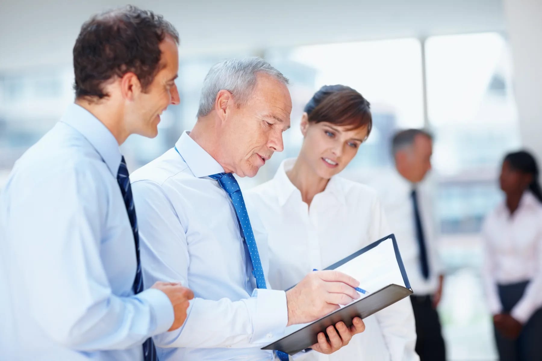 Colleagues going through a pay run together before it is approved