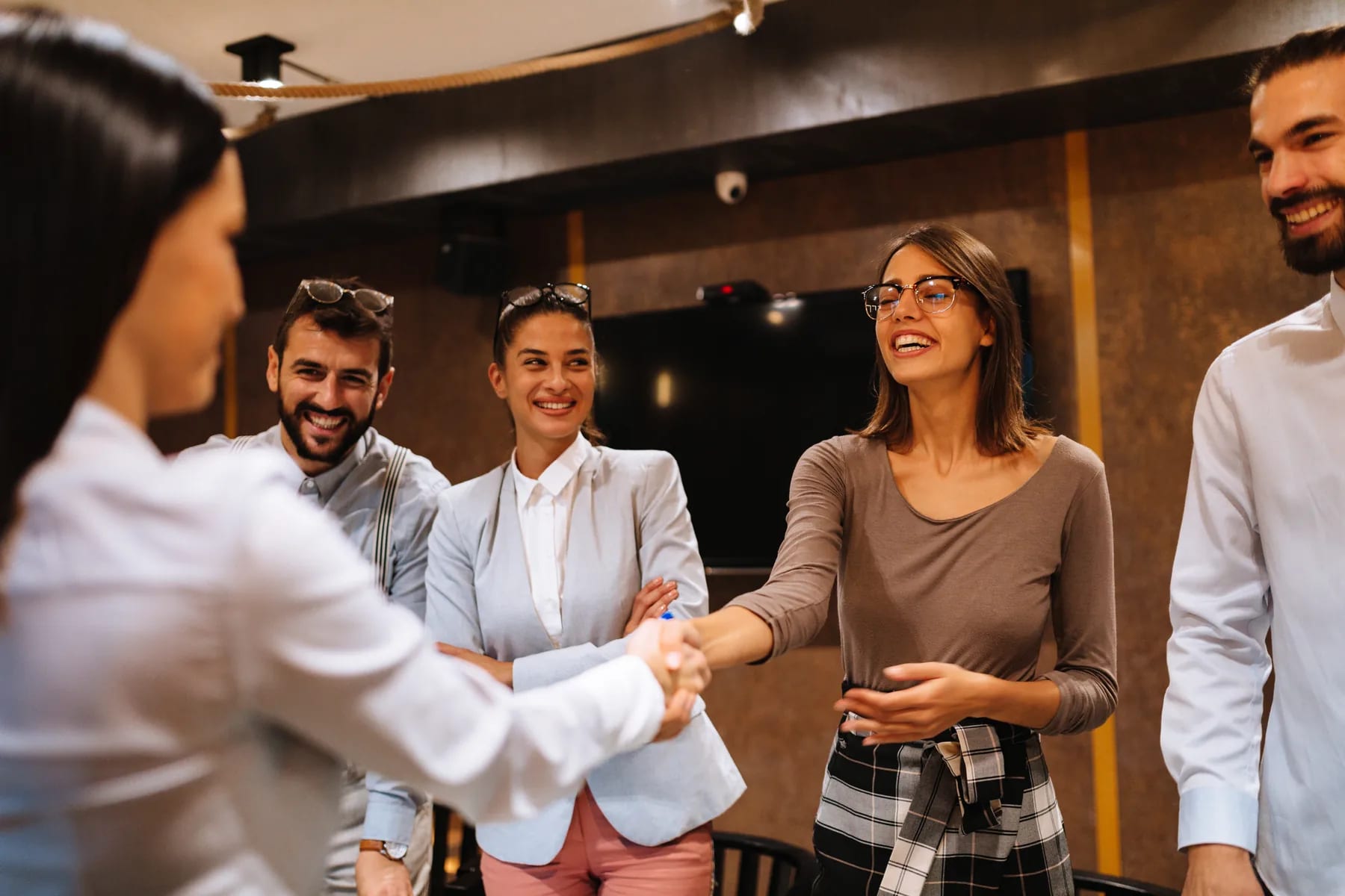 A candidate welcomed by the hiring panel at the start of an interview