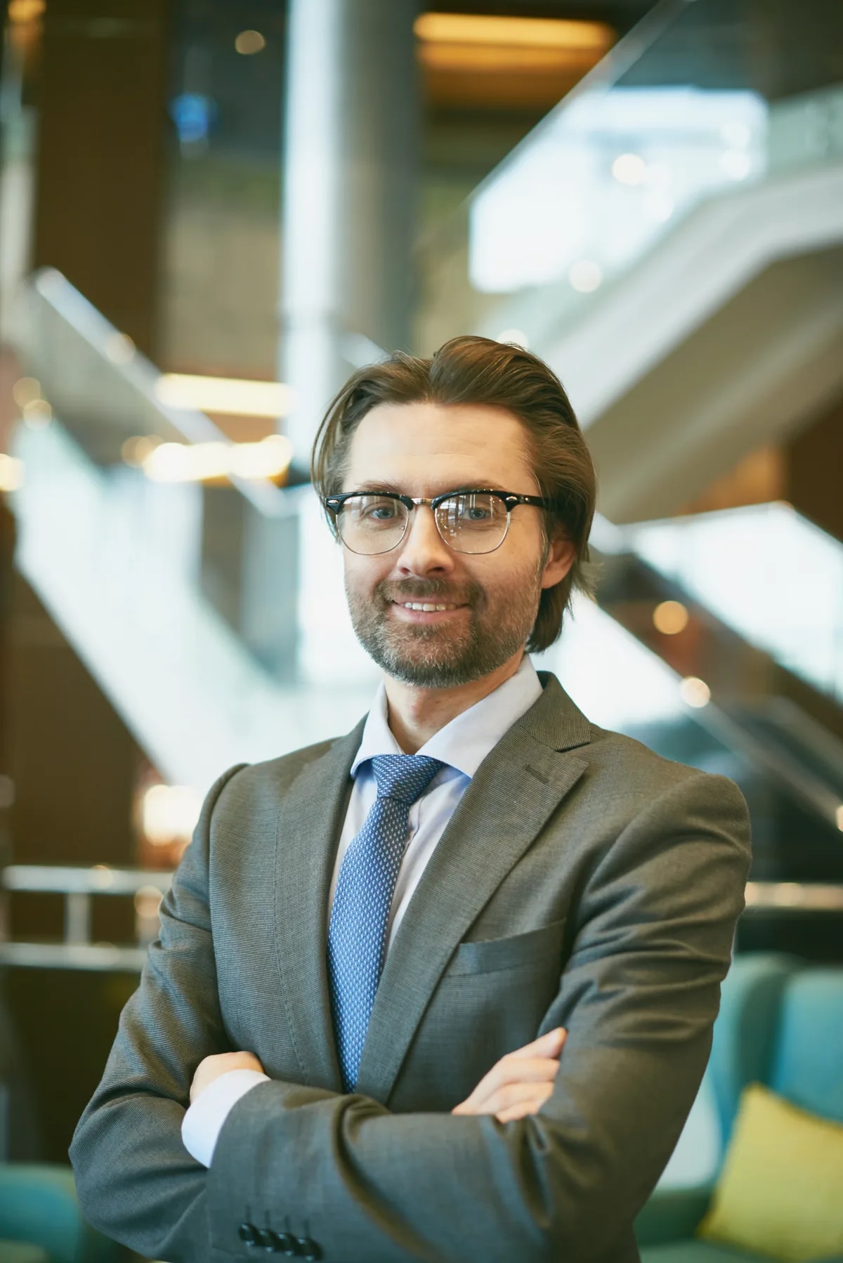 A business leader standing in an office atrium